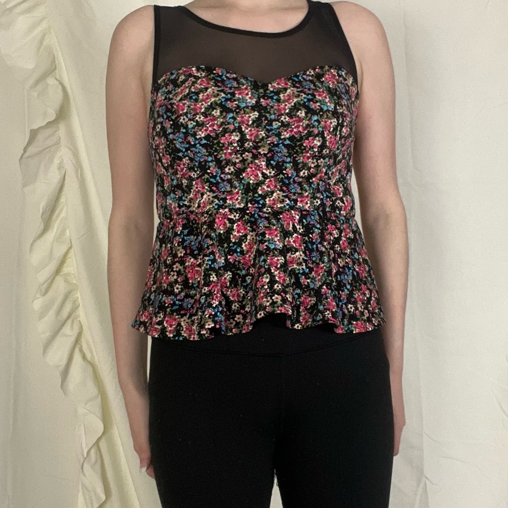 Floral peplum top with black mesh